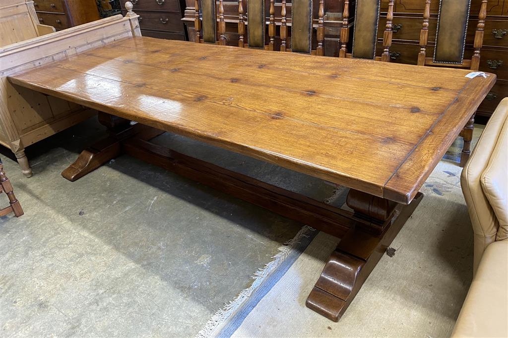 An 18th century style rectangular oak refectory dining table, length 274cm, depth 106cm, height 76cm